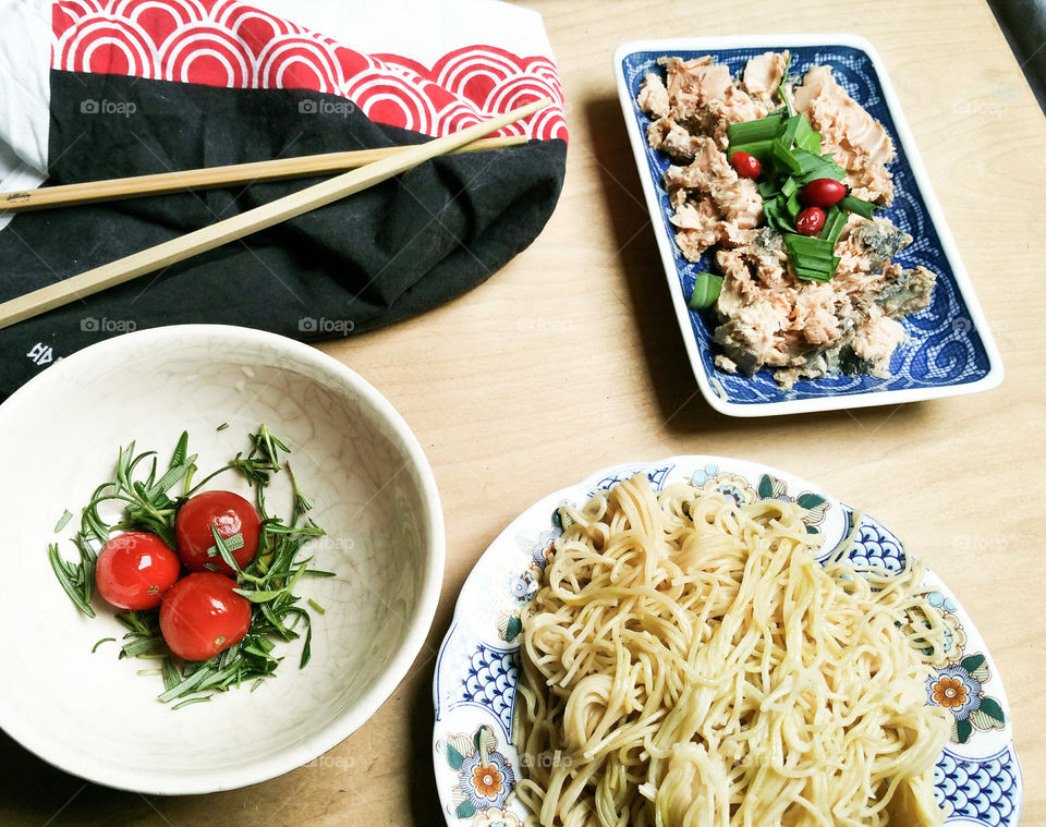 An oriental style lunch on wooden surface