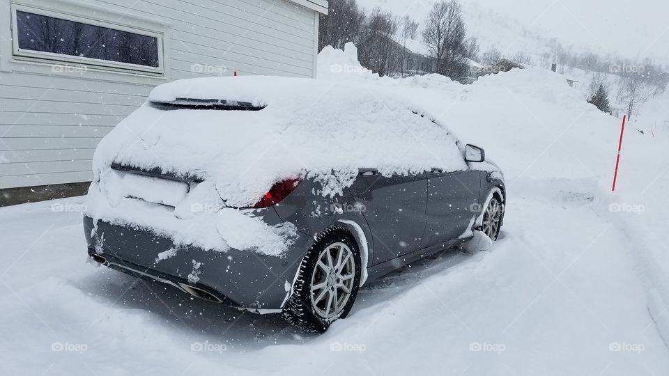 Snow covered car