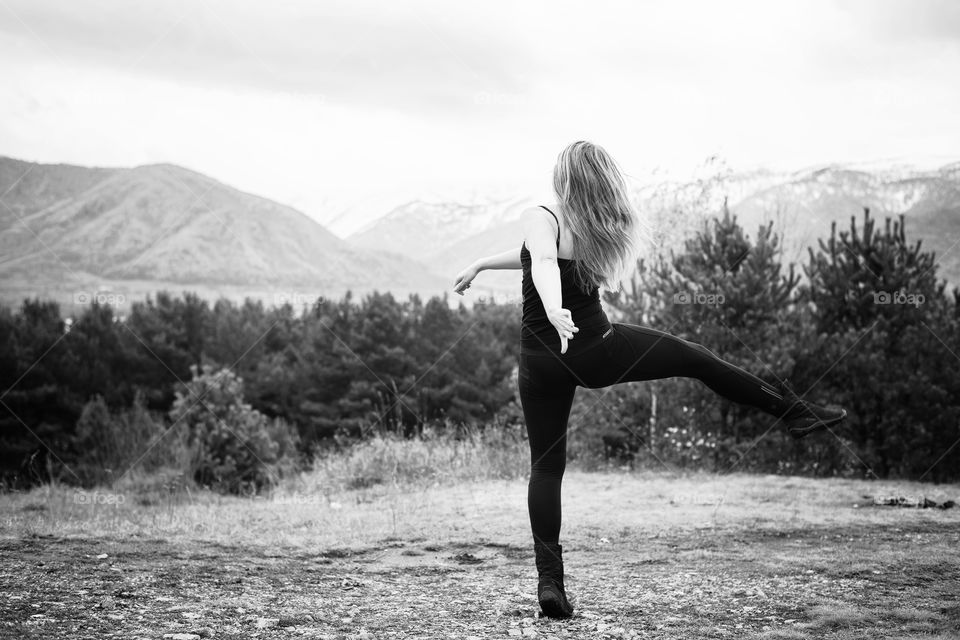 girl dancing on the mountain