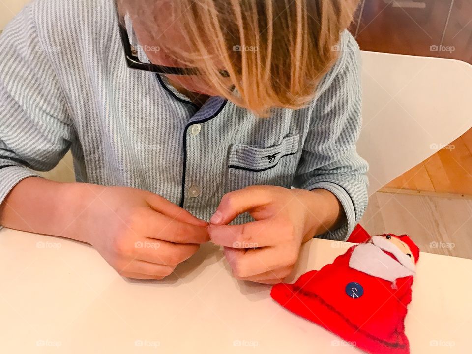 Little boy sewing