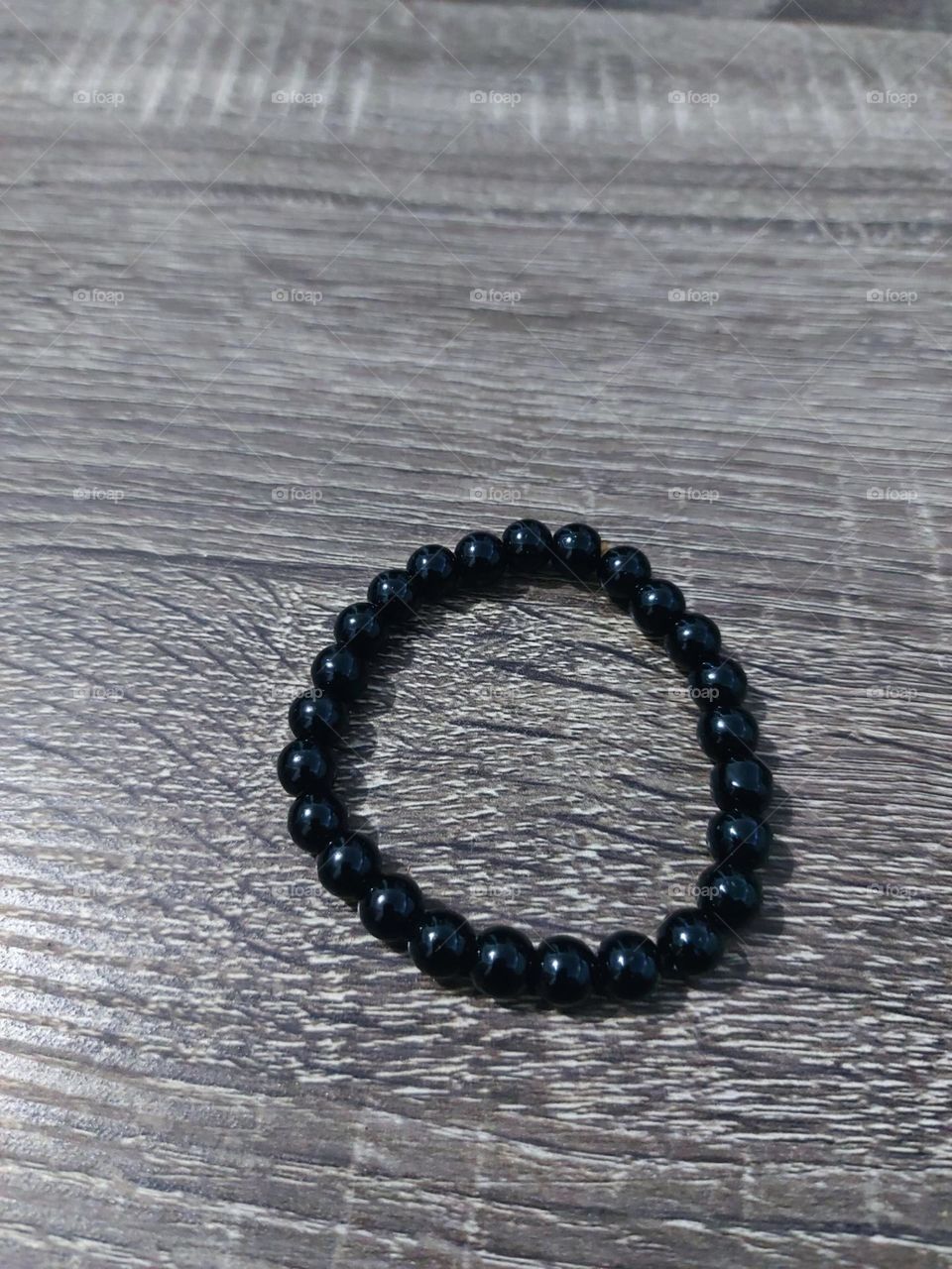 An accessory bracelet made of natural stone carved in a small circle