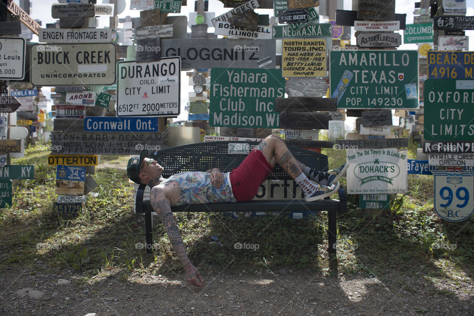 Hipster in Sign Post Forest