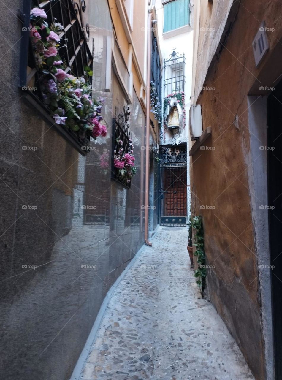 rectangular wooden door at the end of the corridor