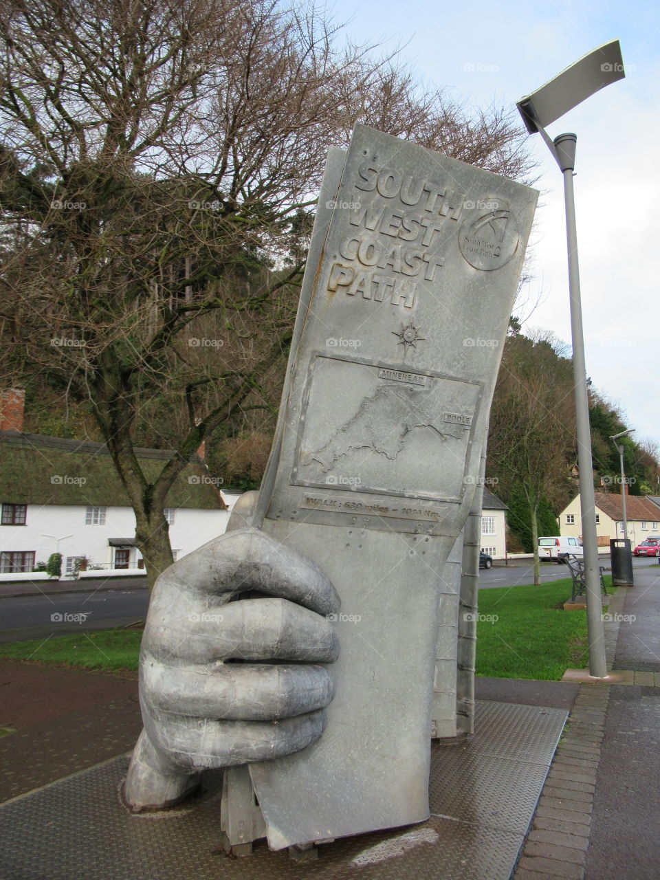 Minehead seafront A hand sculpture holding a giant sign