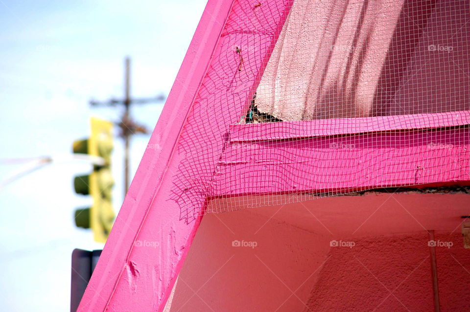 Metal net on wooden window