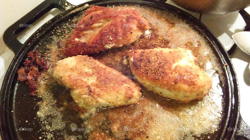 Parmesan and herb crusted fried chicken on my cast iron grill
