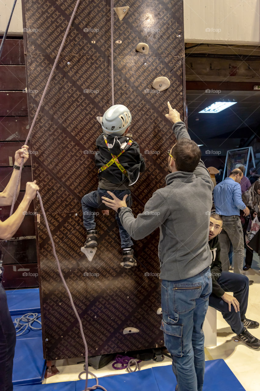 Boy climbing on the wall