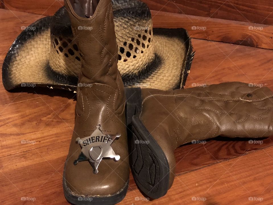 Cowboy hat , boots and a Sherriff badge