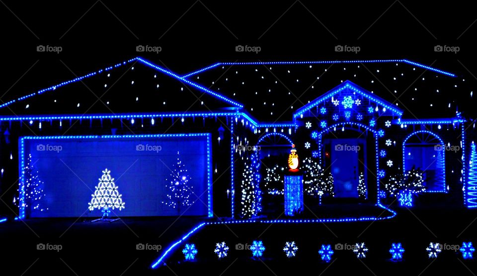 Something to remember - House decorated with magnificent and colorful blue lights. Blue lights represent generosity and spirit. They also signify support for troops abroad