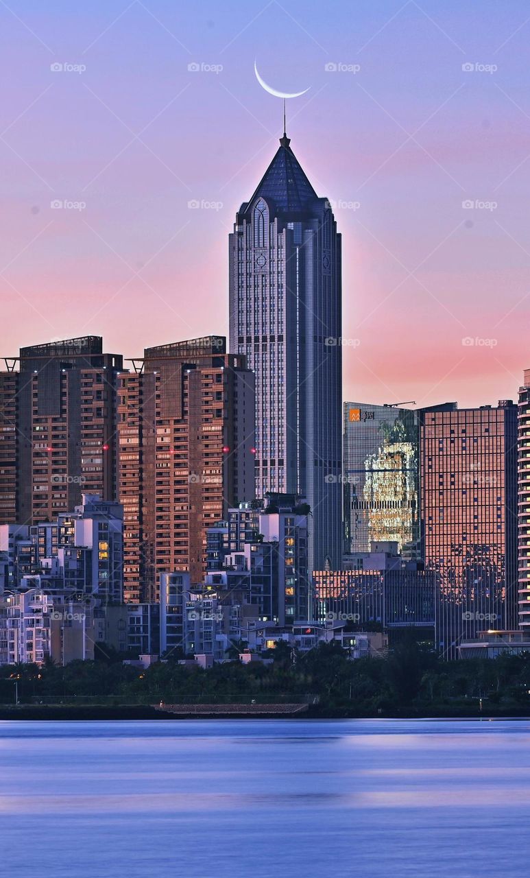 Skyscraper Building with moon on the top 