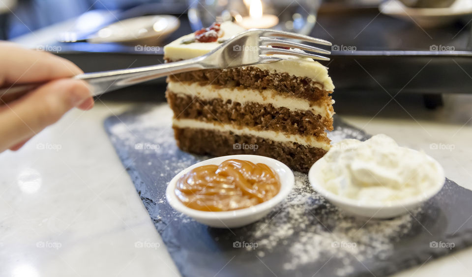 Tasting delicious carrot cake, dessert