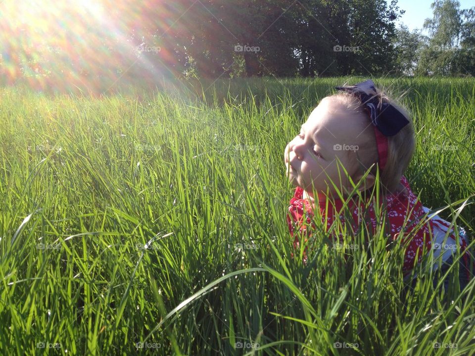 Little girl in green grass