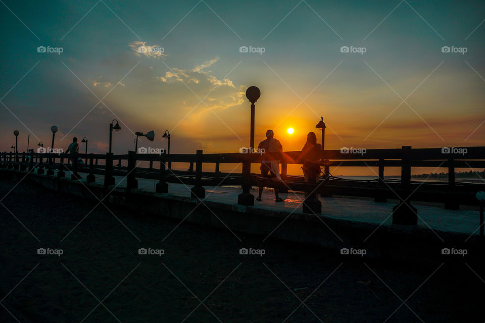 Sunset on a pier on the beaches of the Caribbean