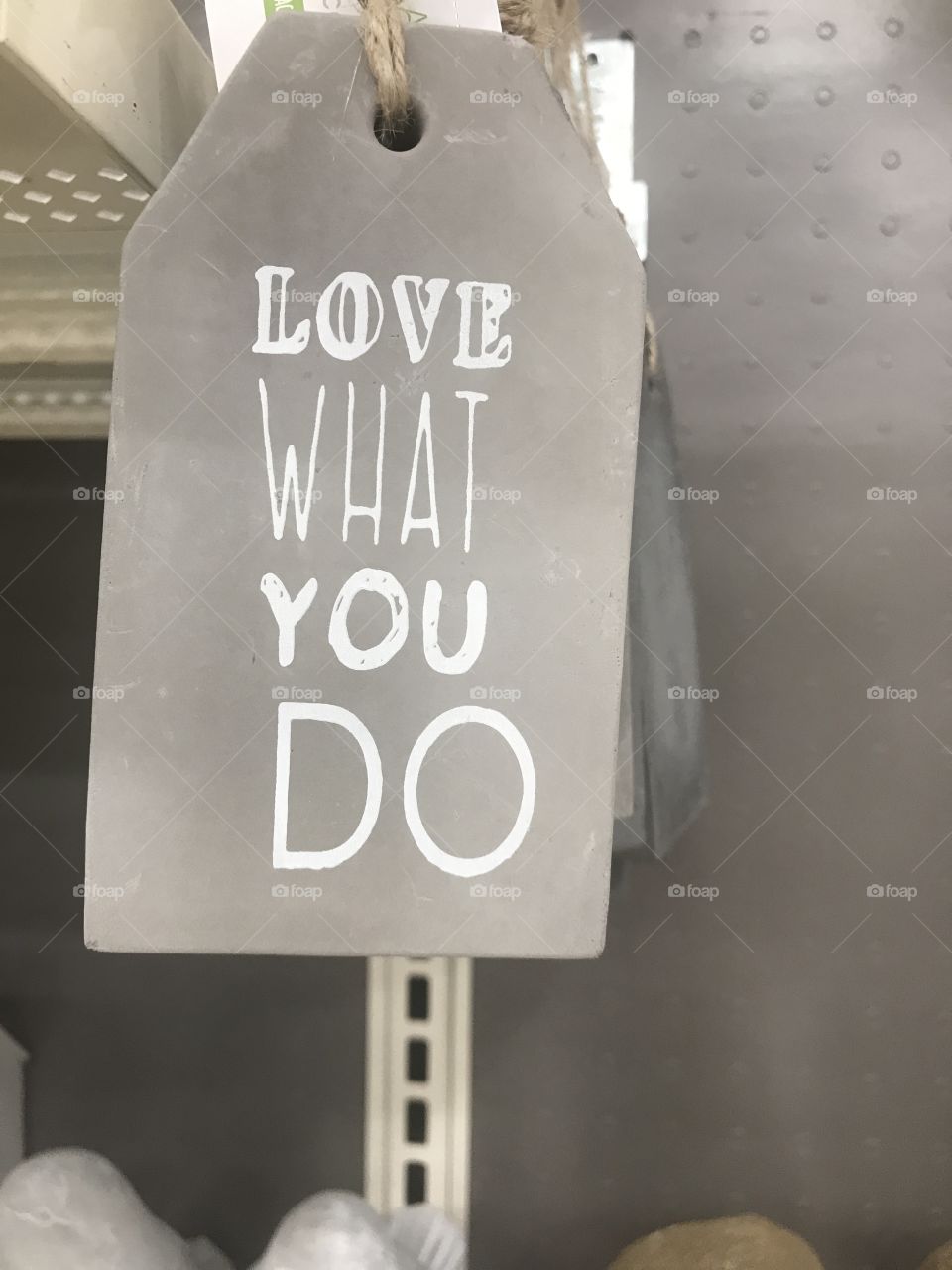 A positive quote, Love what you do sign on display in the arts and craft store. USA, America 