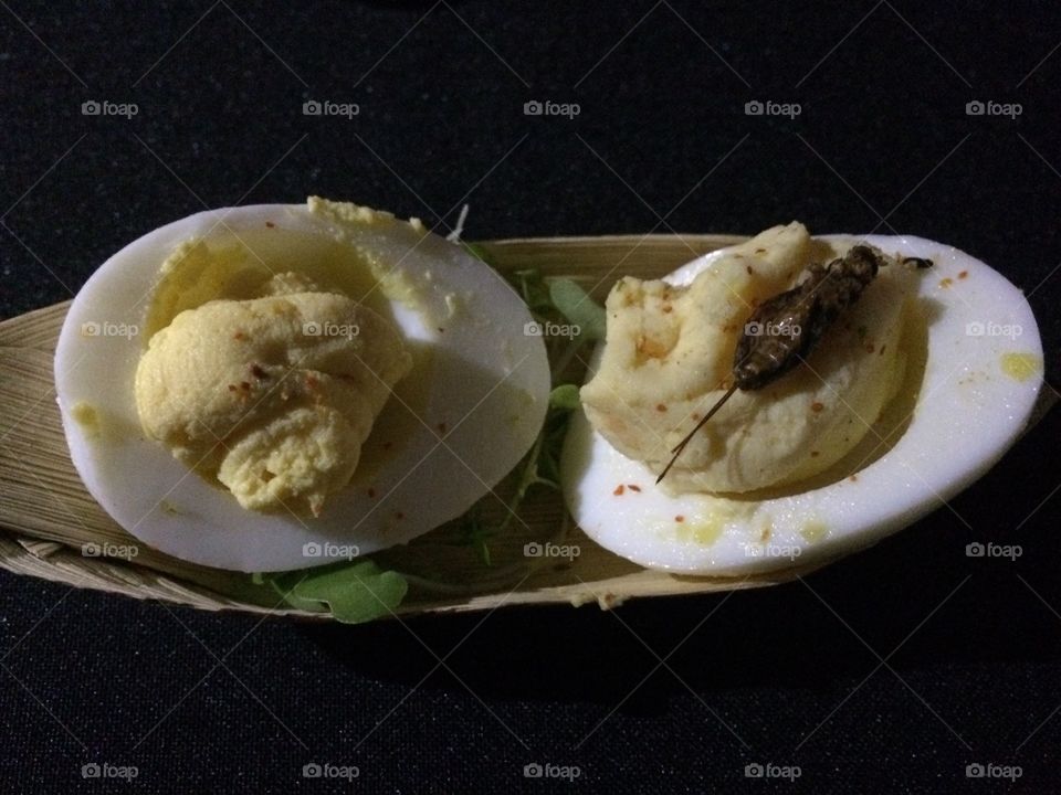 Deviled eggs with crickets