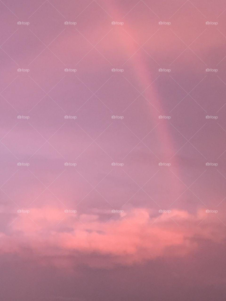 Rainbow in pink clouds