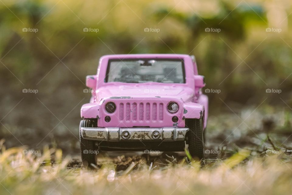 pink car on the road