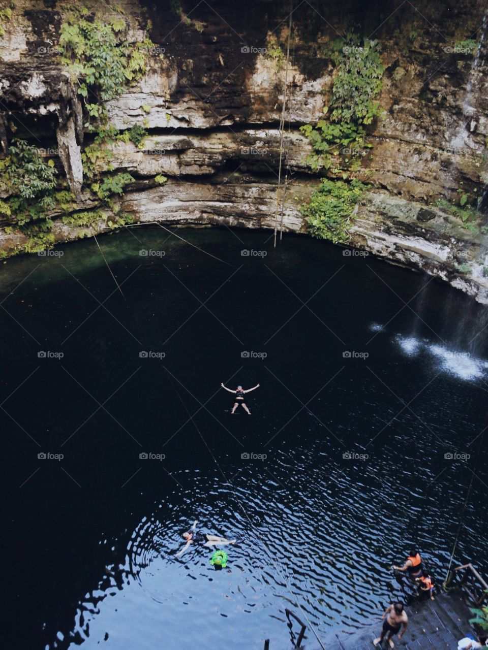 Swimming in a deep sinkhole in the Yucatán Peninsula. 