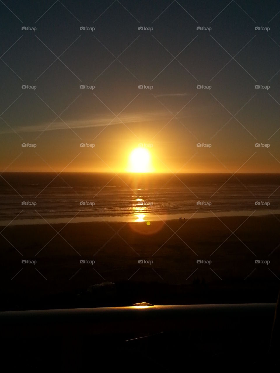 Sunset over the Ocean in Newport,  Oregon. . Sunset photo taken in Newport during a short beach side vacation. 