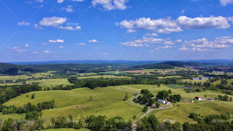 Flying from the top of sky meadows state park over the beautiful country side in northern Virginia - taken by aerial pointe drone