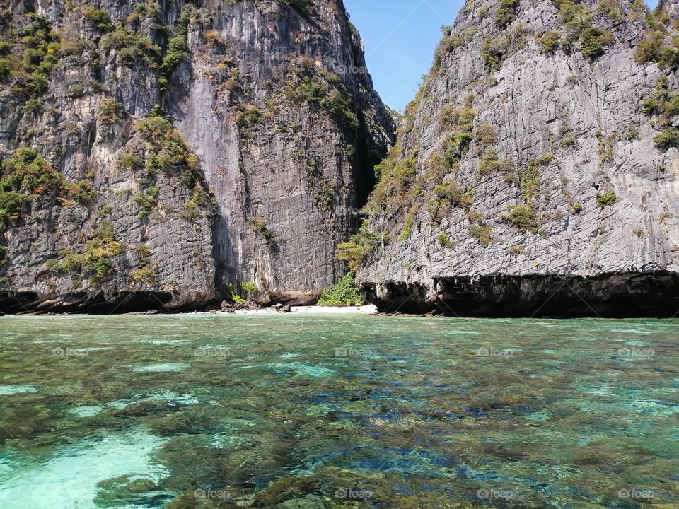 limestone rocks and sea in phi phi lagoon, Thailand