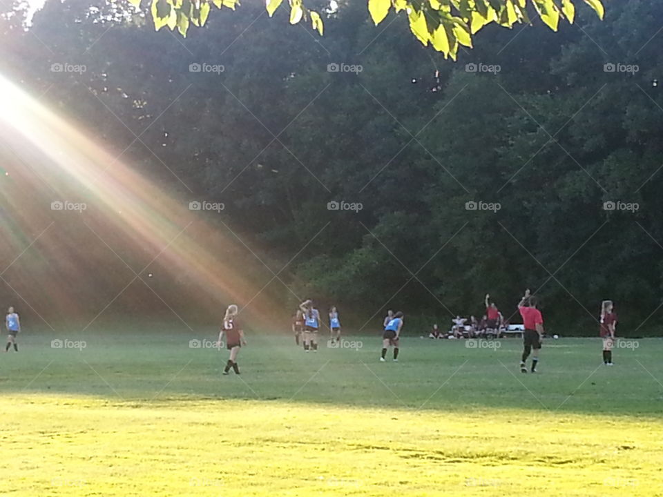 A nice day for a soccer game. watching a soccer game in the park