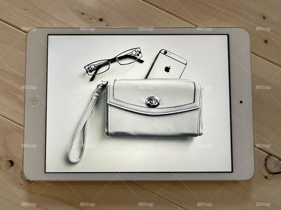 iPad taking a picture of a purse containing an iPhone...
