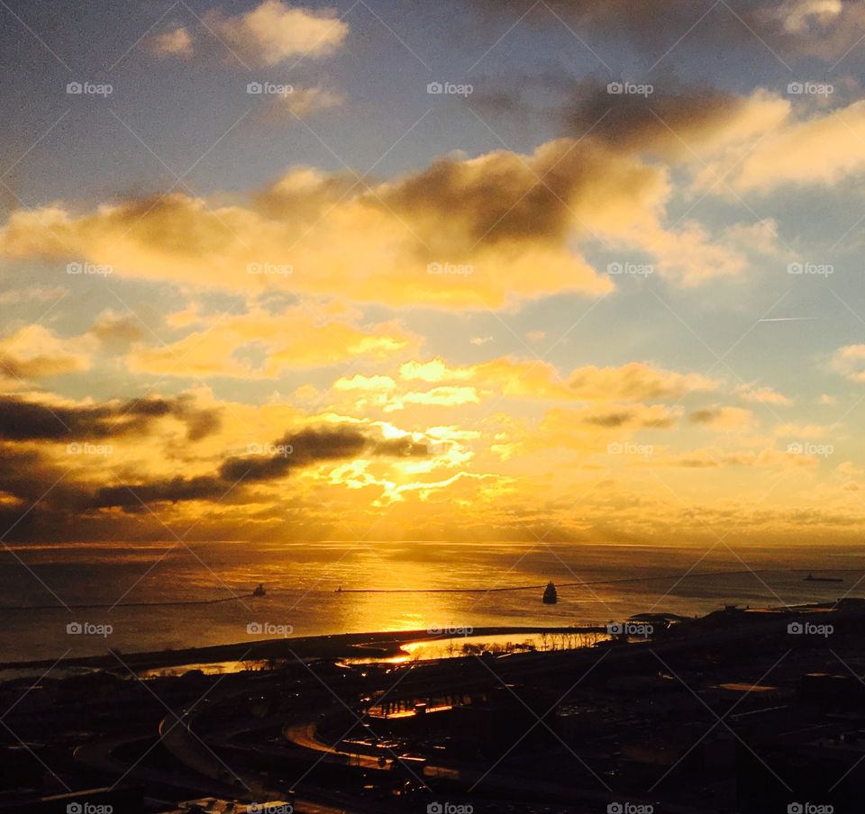 Dramatic sky over town and sea at dusk