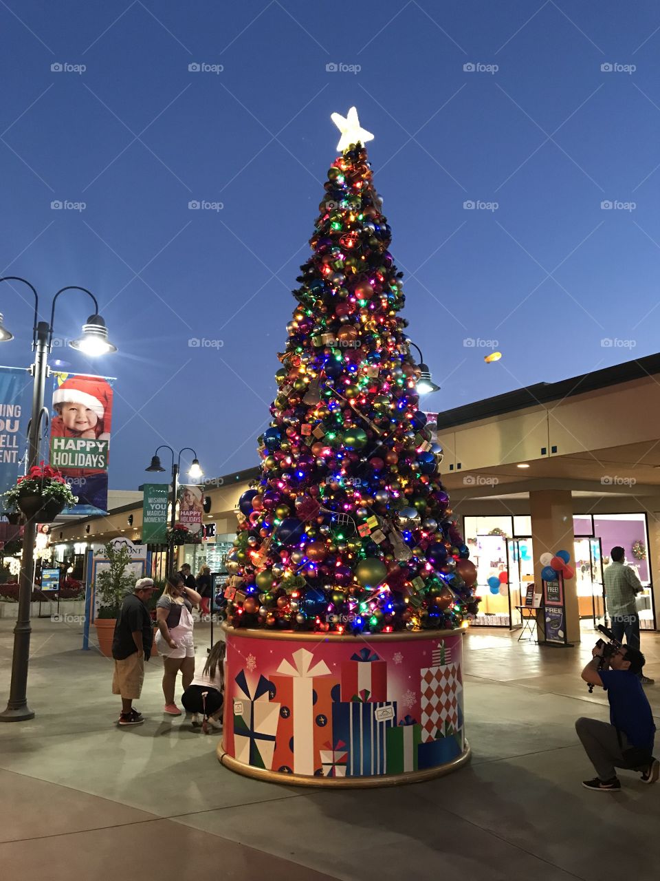 The tall Christmas Tree is lit at center court of Grossmont Center near San Diego, CA on November 24, 2017 as the holidays begin.
