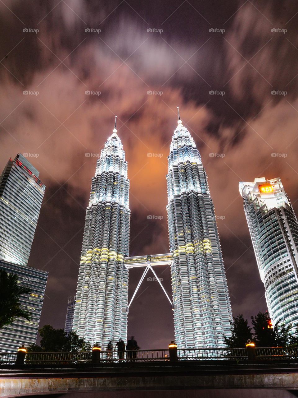 Clouds in motion above Petronas Towers Kuala Lumpur