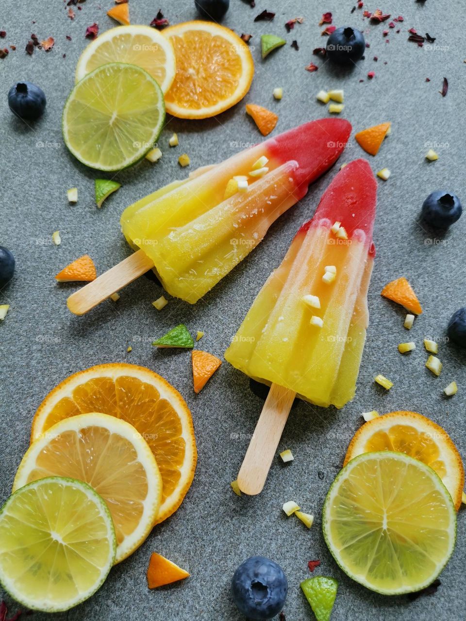 Love yellow color. Tasty and juicy ice lollipops and fruits : orange, lemon and lime.