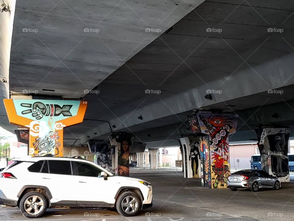 Urban visual street art under Highway on the highway cement pillars.