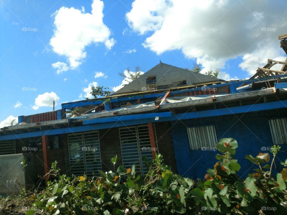 Hurricane damage to building. Ripped second story off.