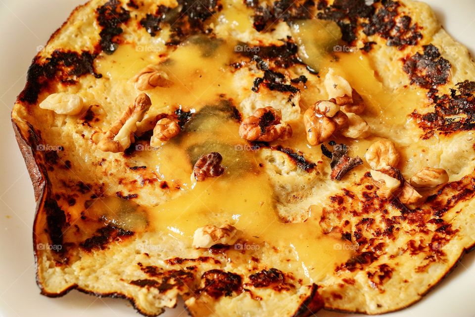Banana pancake with honey and walnuts