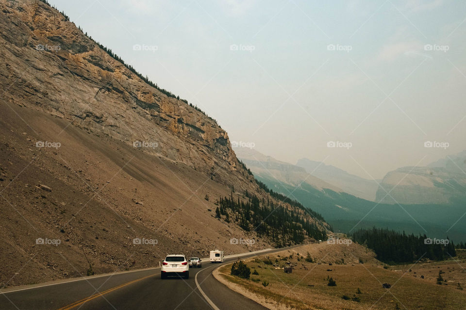 Driving into smoky Mountains in Alberta
