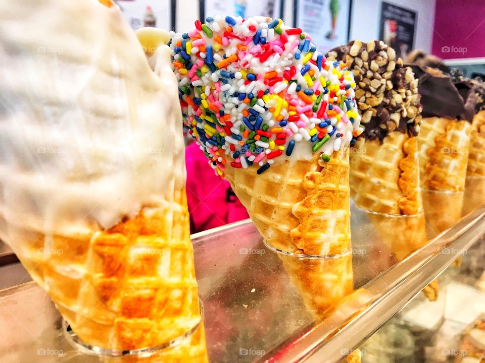 Colorful Waffle Ice Cream Cones with Various Toppings