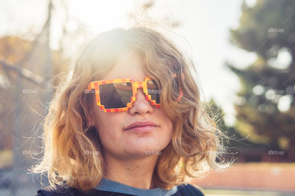 curly hair girl in sunglasses