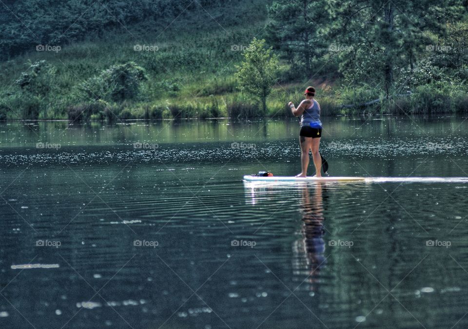 paddle boarder on the lake