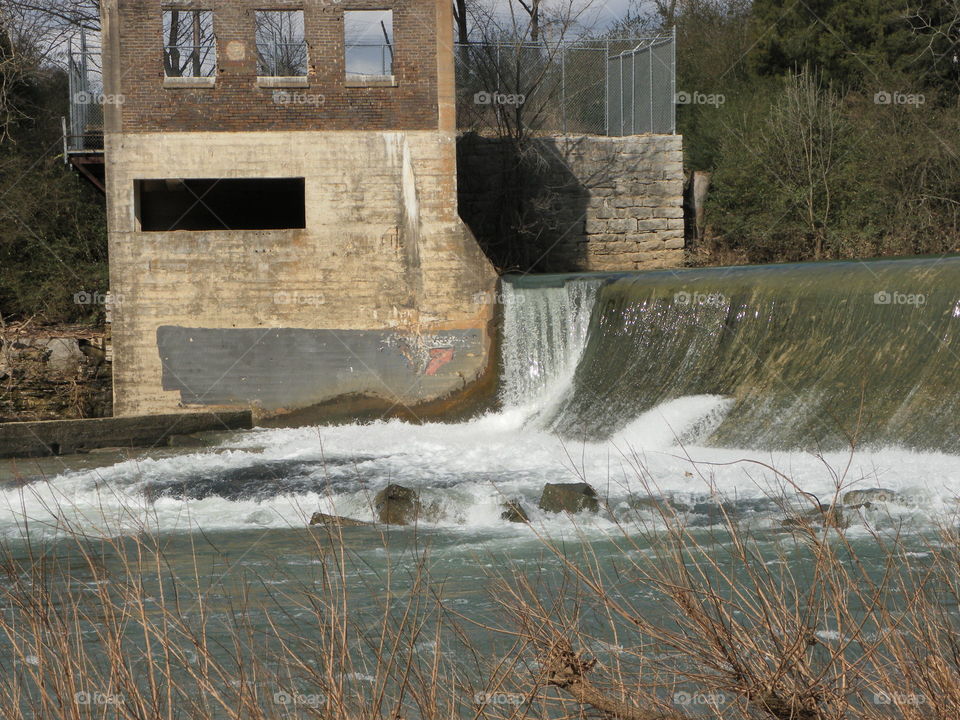 Waterfall and old building