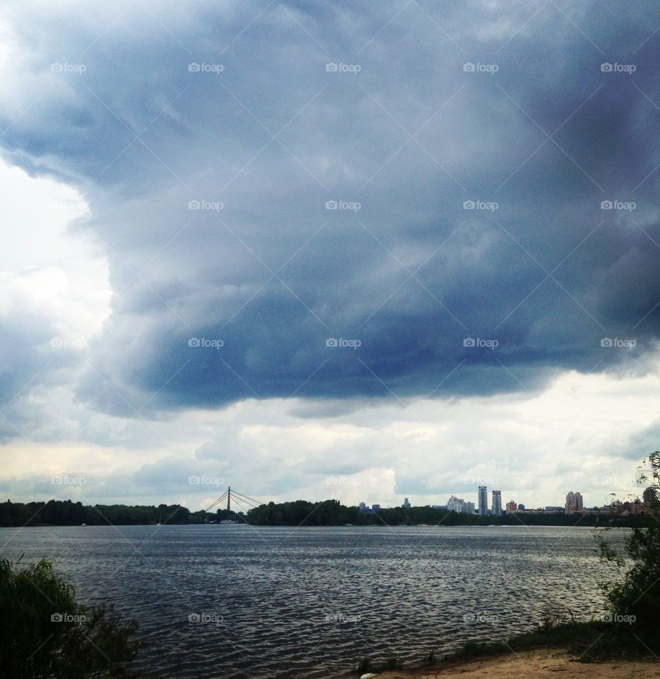 Storm clouds over river