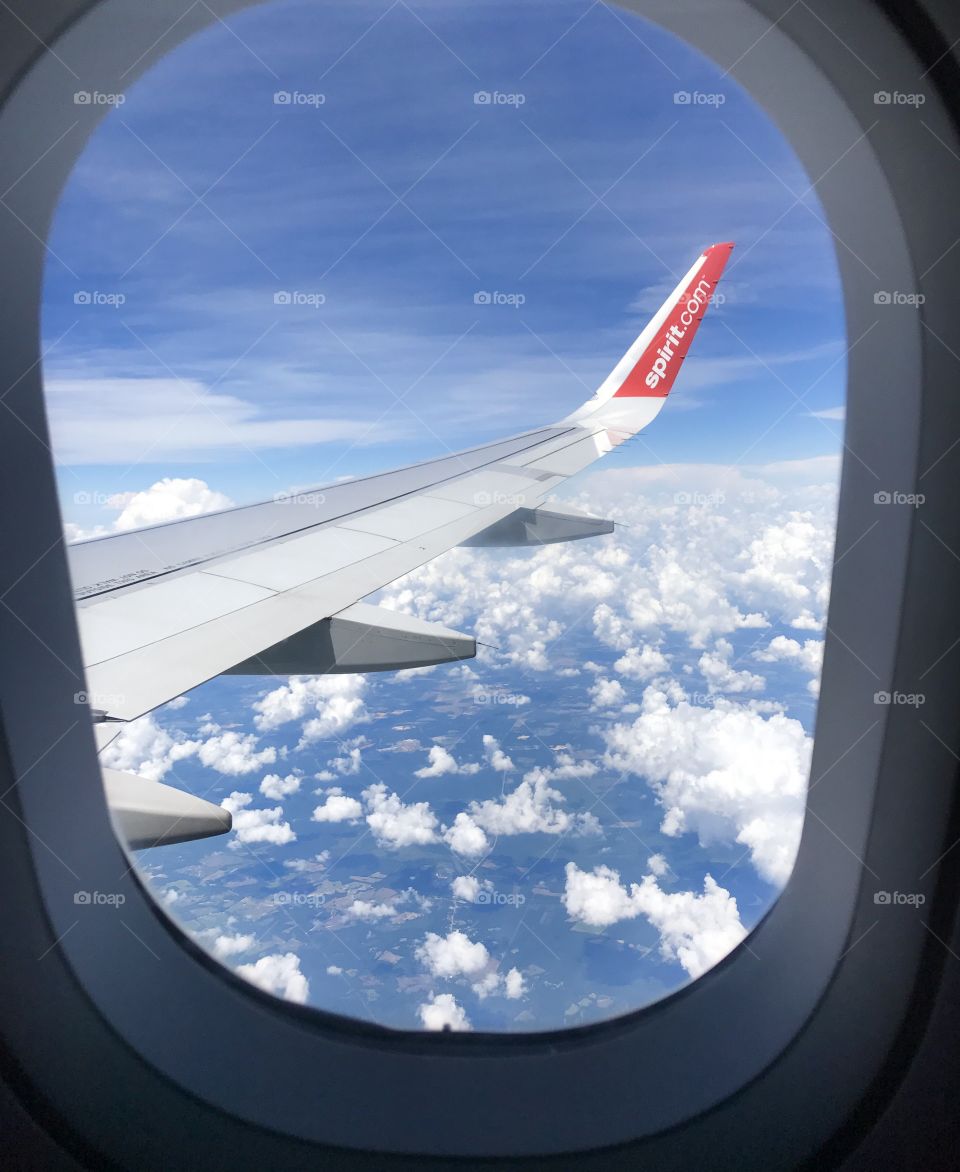 Composition, Framing, plane window with sky and wing visible