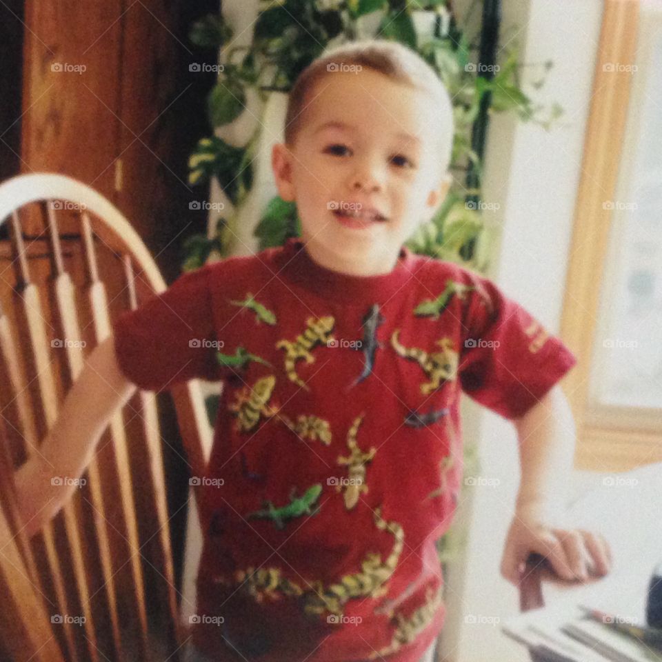 Boy wearing gecko/lizard shirt