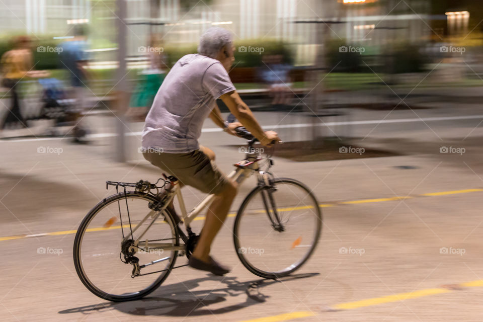 Middle Aged Man On Bike Ride In The City