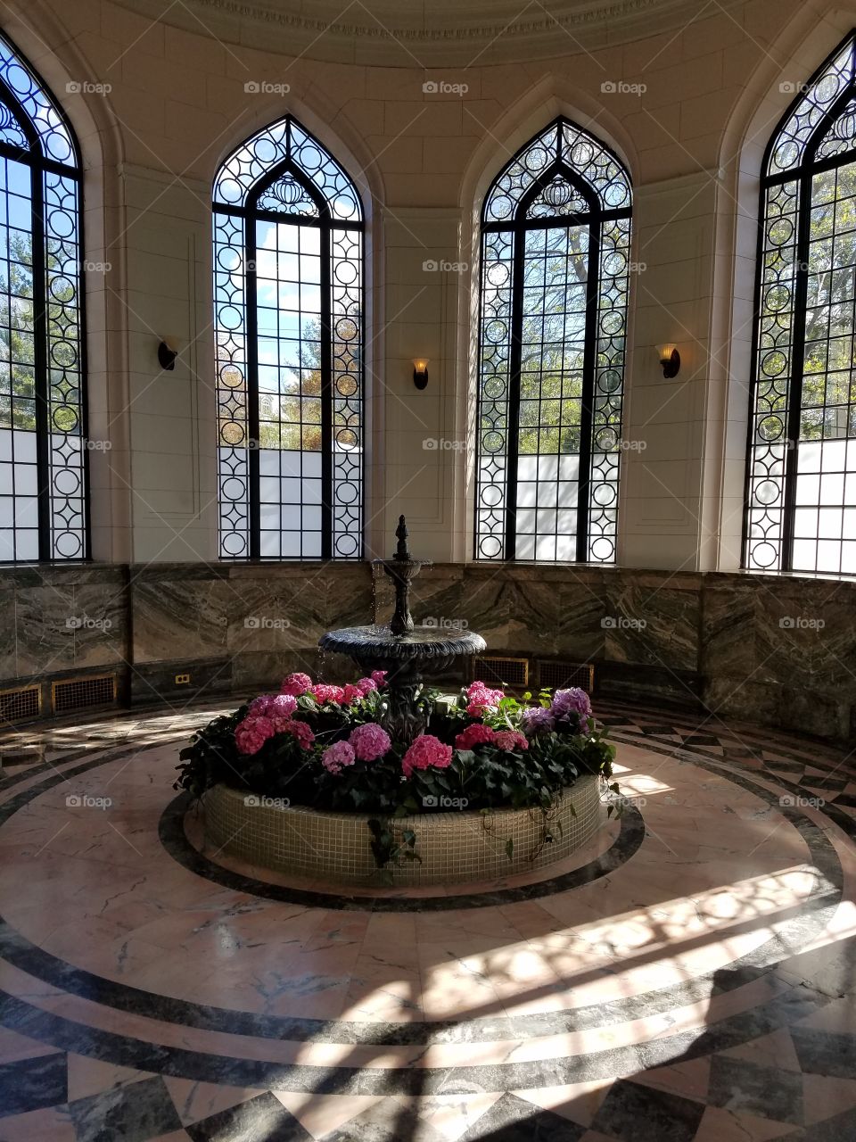 floral fountain in glass atrium