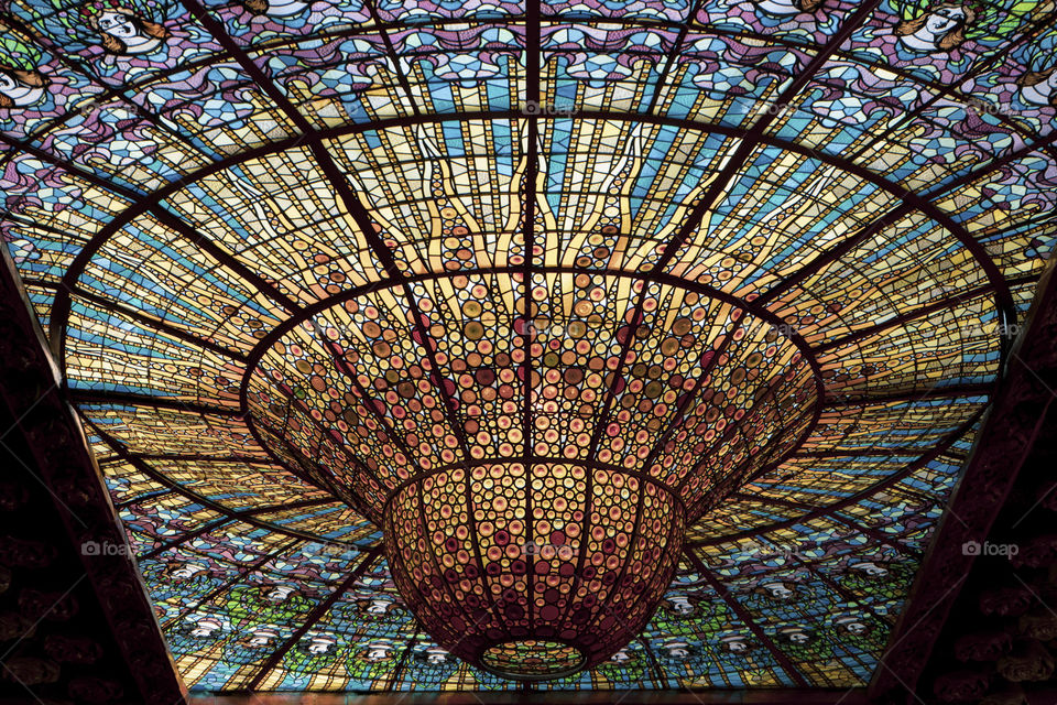 The roof of the Palace of Music in Barcelona. Composed of a colored glass mosaic that descends with a small dome on the contrary.