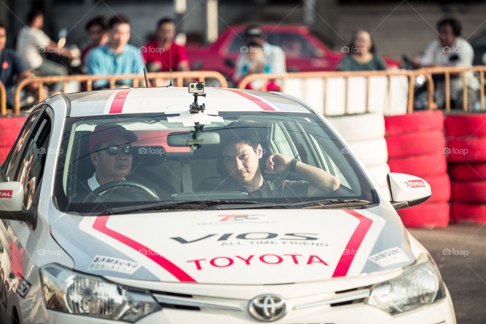 Driver inside racing car