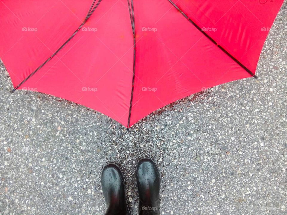 Black Gumboot and red Umbrella