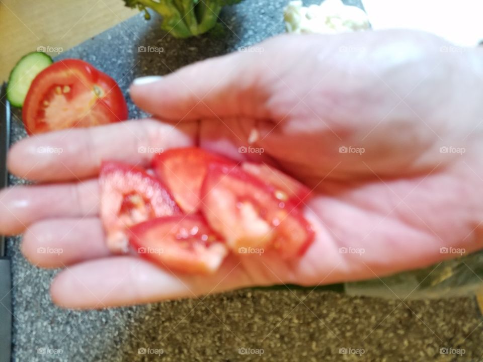 Holding food tomato sliced