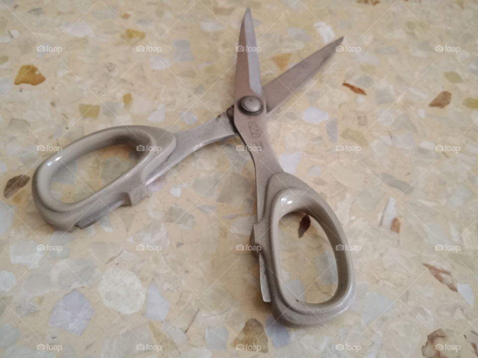 The light brown metal scissors