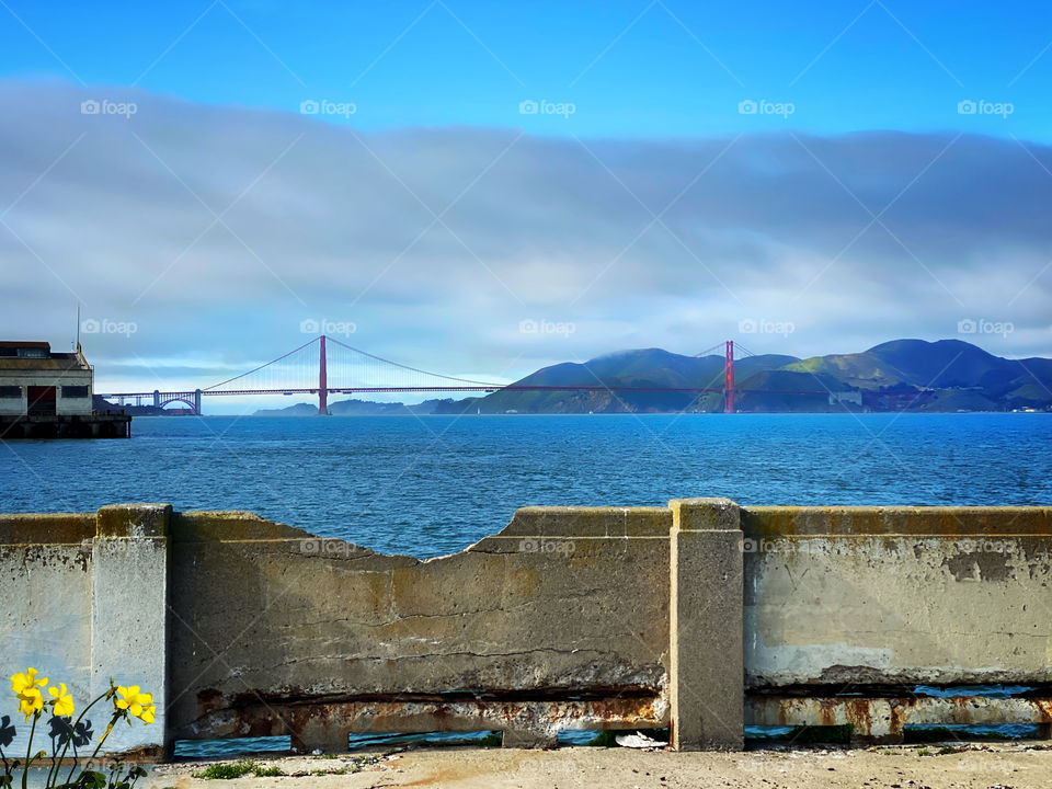 San Francisco’s Golden Gate Bridge seen from a dilapidated pier